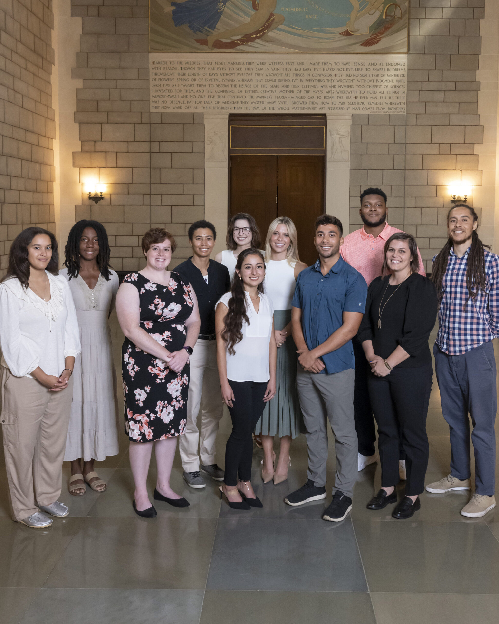 Group of 11 fellows in the National Academy of Sciences atrium in Washington DC